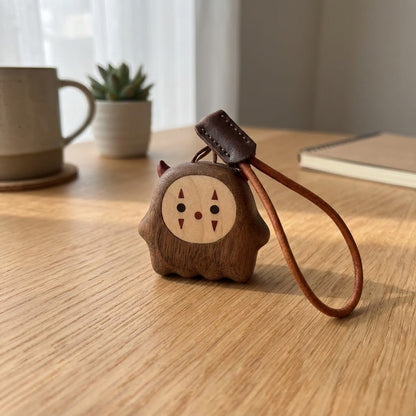 Wooden desk ornament placed on a tabletop as a funny desk gadget