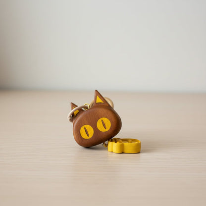 Wooden desk ornament placed on a tabletop as a funny desk gadget