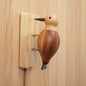 Wooden woodpecker wall ornament mounted on a wall