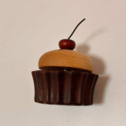 Wooden desk ornament placed on a tabletop as a funny desk gadget