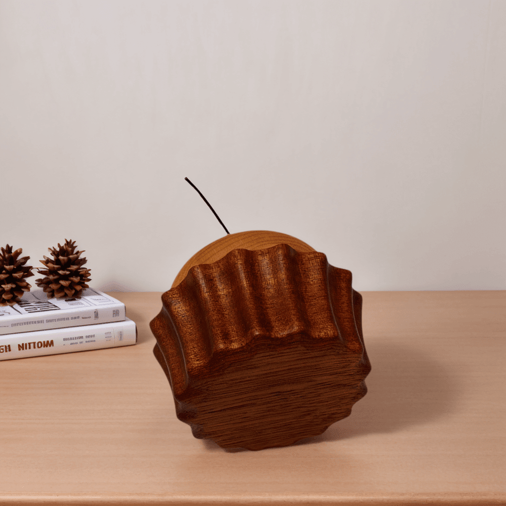 Side view of a wooden cake music box on a desk
