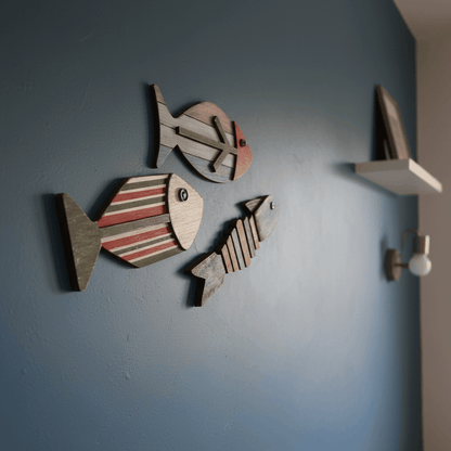 Side view of a wooden fish wall decor mounted on a wall