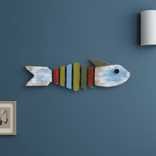 Wooden fish wall decor mounted on a wall with Mediterranean style
